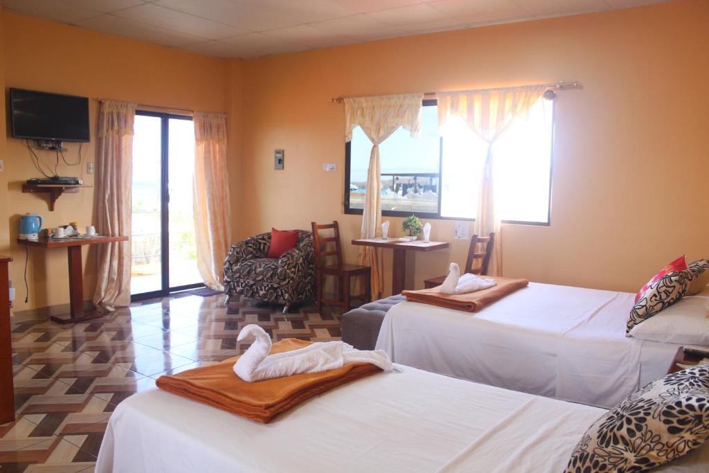 Postel nebo postele na pokoji v ubytování Hostal Romy