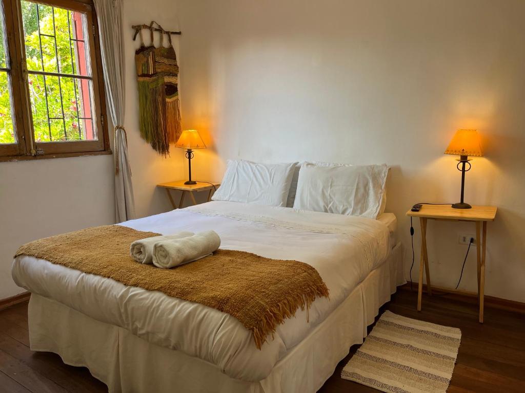 Postel nebo postele na pokoji v ubytování El Arbol Hostel