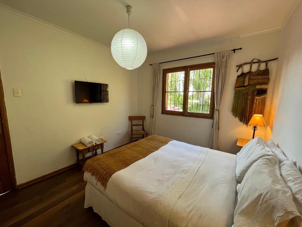Postel nebo postele na pokoji v ubytování El Arbol Hostel