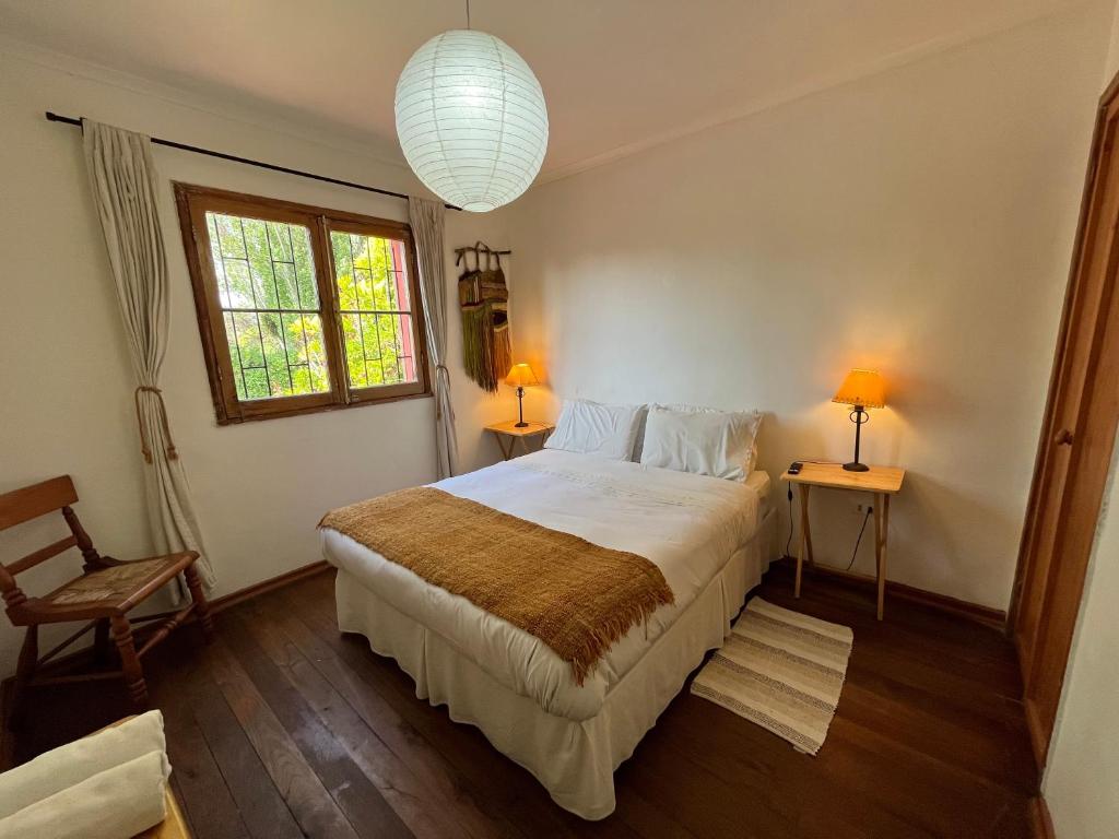 Postel nebo postele na pokoji v ubytování El Arbol Hostel