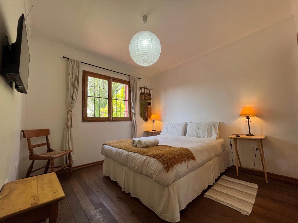 Postel nebo postele na pokoji v ubytování El Arbol Hostel