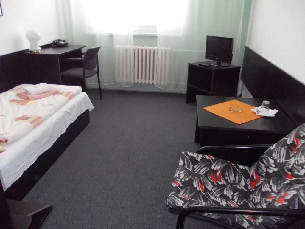 Postel nebo postele na pokoji v ubytování Hotel Milotel