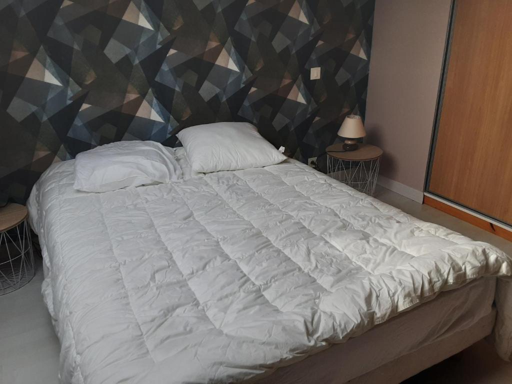 Postel nebo postele na pokoji v ubytování Appartement du parc