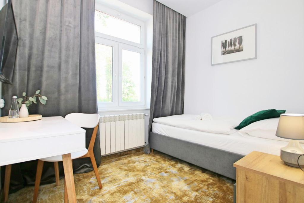 Postel nebo postele na pokoji v ubytování Willa Portus