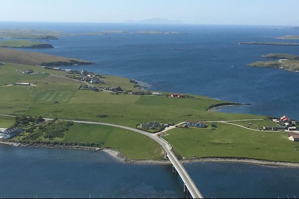 an aerial view of an island with a bridge over water at Wasterview, Central Mainland, Ideal base in Lerwick