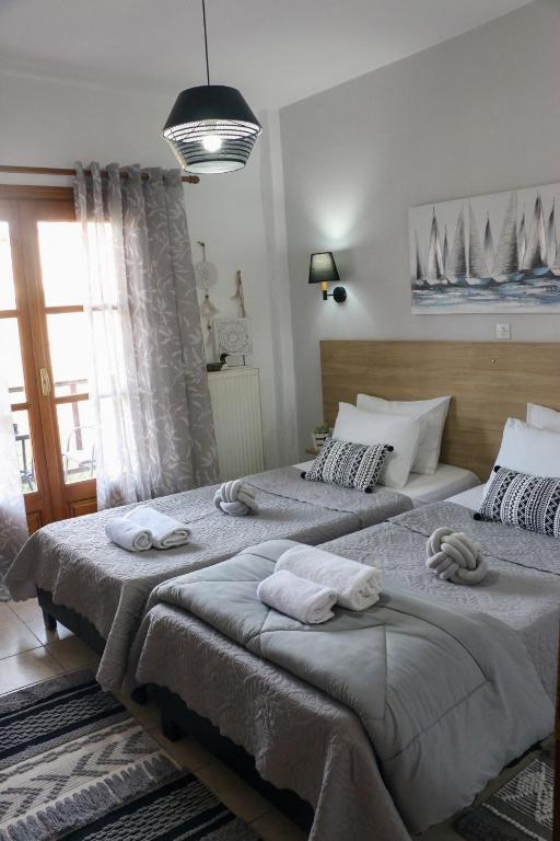 Postel nebo postele na pokoji v ubytování Villa Evgenia(Leonidas)