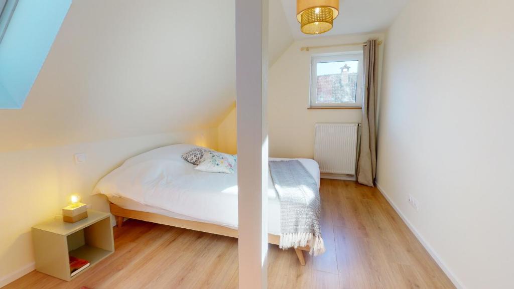 Łóżko lub łóżka w pokoju w obiekcie Appartements Le Tilleul de la Vallée Noble