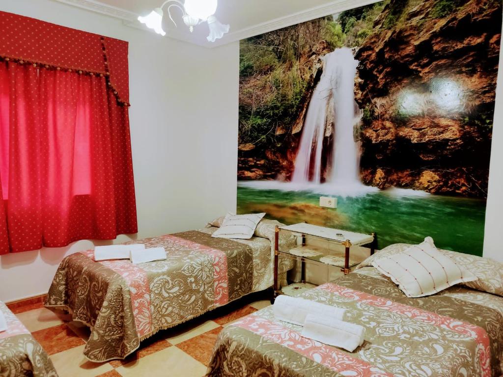 Postel nebo postele na pokoji v ubytování Vivienda rural Saltos de la Osera