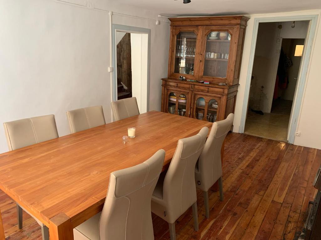 a dining room with a wooden table and chairs at Colmars les Alpes in Colmars