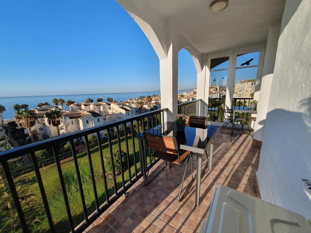 a balcony with a view of the ocean at Casa Alegria - Laguna Beach in Torrox Costa