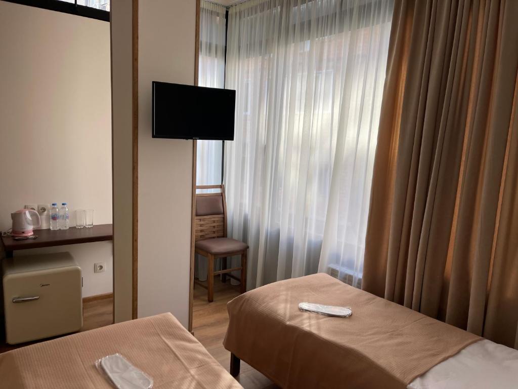 Postel nebo postele na pokoji v ubytování ART family hotel