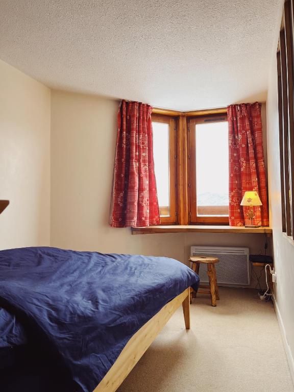 Posteľ alebo postele v izbe v ubytovaní Appartement Courchevel la Tania