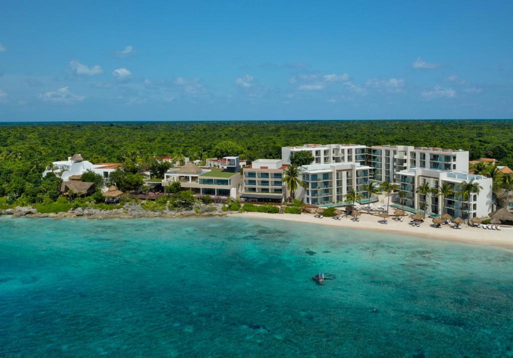 an aerial view of a resort on a beach at Dreams Cozumel Cape Resort & Spa in Cozumel