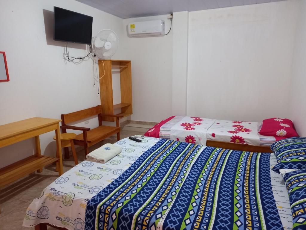 Postel nebo postele na pokoji v ubytování Hotel CHAFO