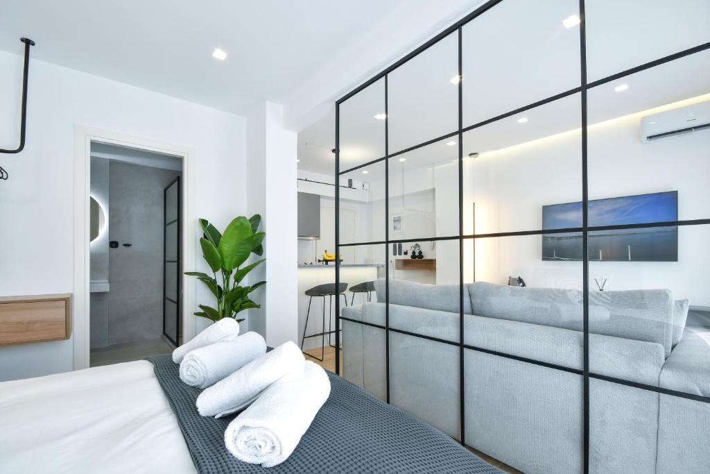 a bedroom with a large glass wall at Luxury Downtown Apartment C1 in Thessaloniki
