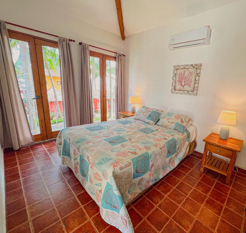 Una cama o camas en una habitación de Hotel Punta Franca