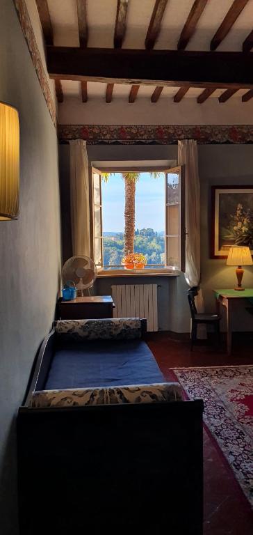 A bed or beds in a room at Soggiorno Dimora Del Grifo