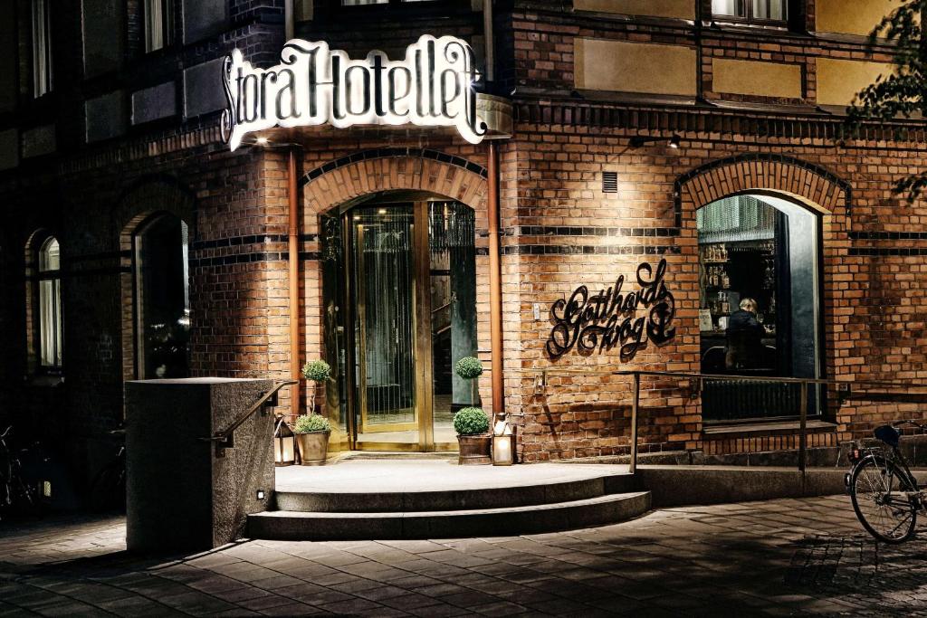 a store front of a brick building with a sign on it at Stora Hotellet; BW Premier Collection in Umeå