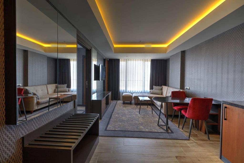 Posezení v ubytování Nova Vista Deluxe & Suites a Member of Radisson Individuals