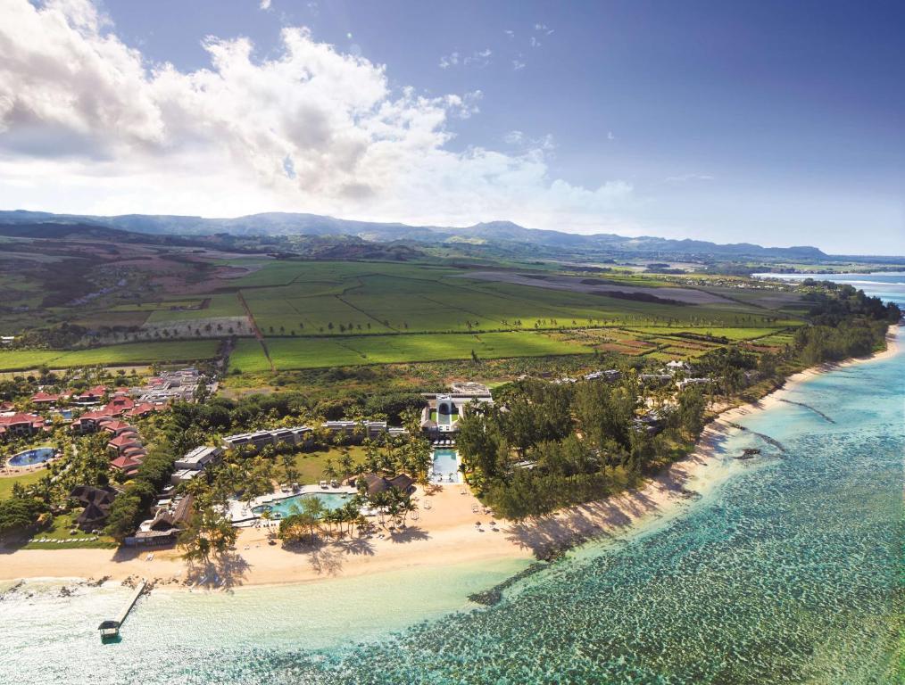 an aerial view of a beach with a resort at Outrigger Mauritius Beach Resort in Bel Ombre