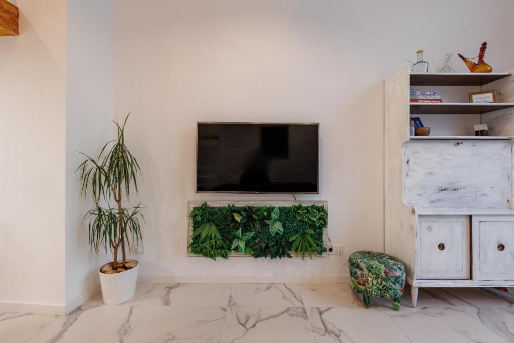 Televízia a/alebo spoločenská miestnosť v ubytovaní Loft con mucha luz en el centro Barrio Ruzafa
