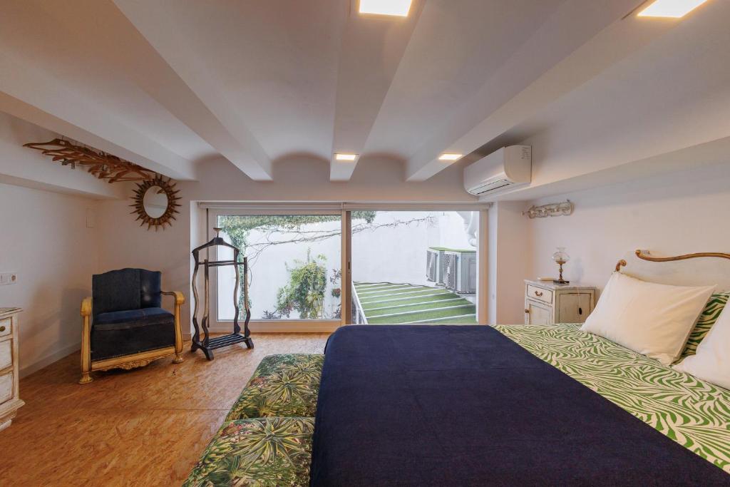 Posteľ alebo postele v izbe v ubytovaní Loft con mucha luz en el centro Barrio Ruzafa