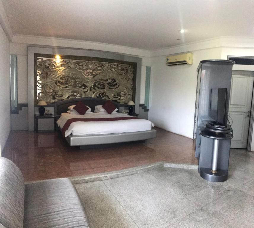 Postel nebo postele na pokoji v ubytování Hotel New Puri Garden