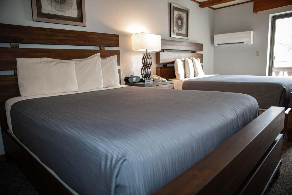 Postel nebo postele na pokoji v ubytování Hotel Vienna