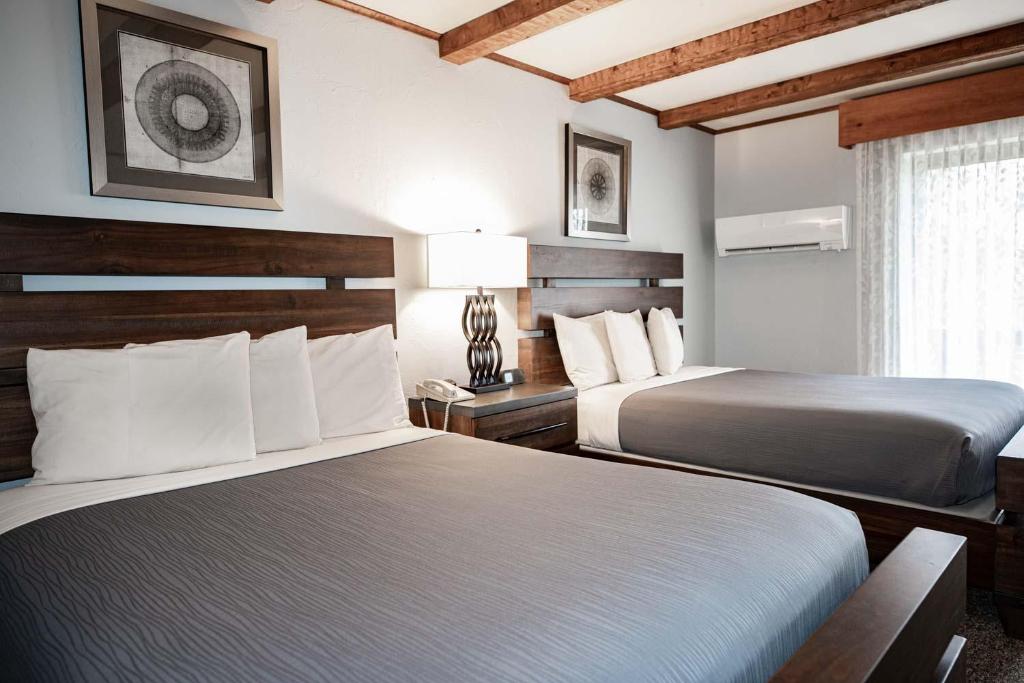 Postel nebo postele na pokoji v ubytování Hotel Vienna