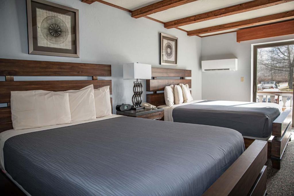 Postel nebo postele na pokoji v ubytování Hotel Vienna