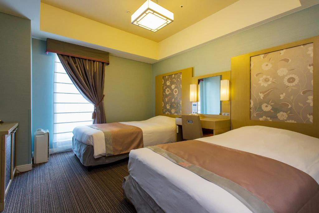 Postel nebo postele na pokoji v ubytování Hotel Monterey Hanzomon
