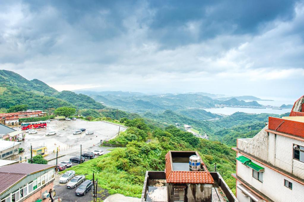 a view of a town with a river and mountains at Jiufen Kite Museum in Jiufen