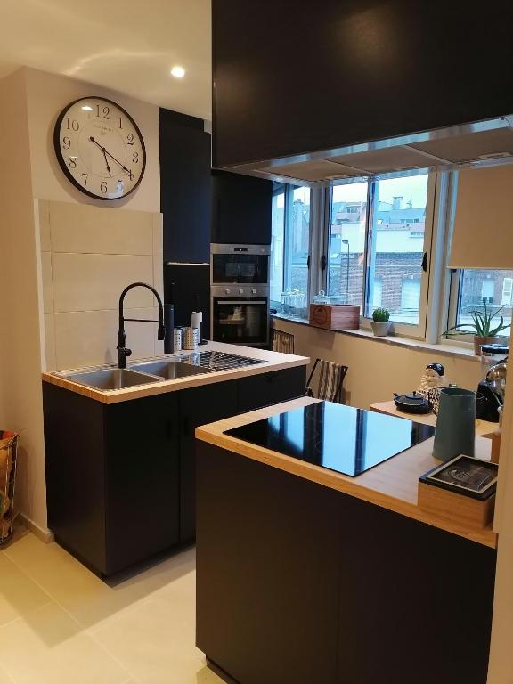 Kuchyňa alebo kuchynka v ubytovaní Le Paul Chandon Centre-ville 4 pers