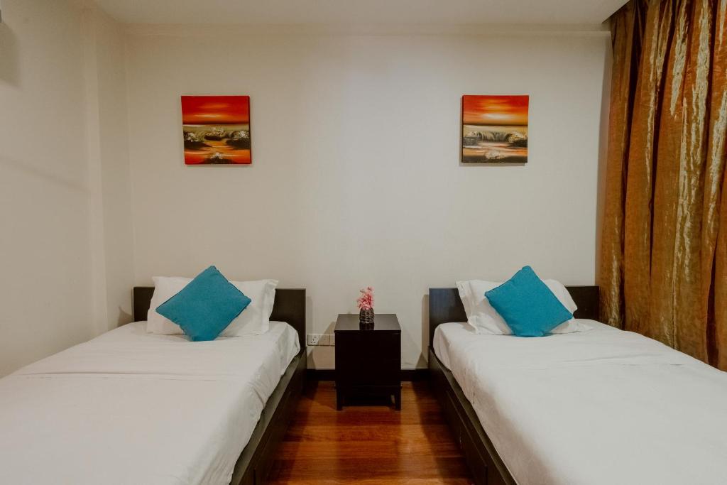 Postel nebo postele na pokoji v ubytování Borneo Beach Villa & Suite