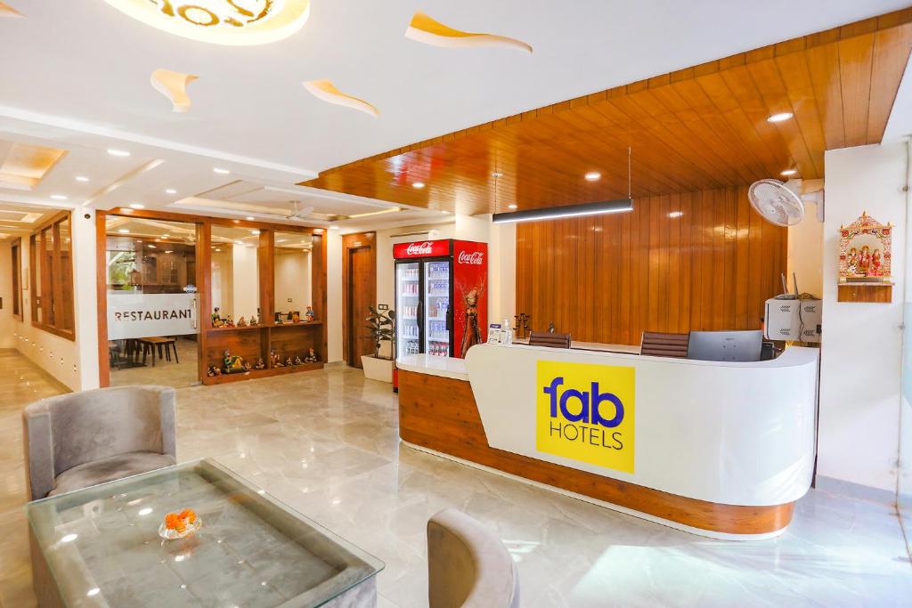 a hotel lobby with a tub in the middle of it at FabHotel Golf Inn Golf Course Road Gurgaon in Gurgaon