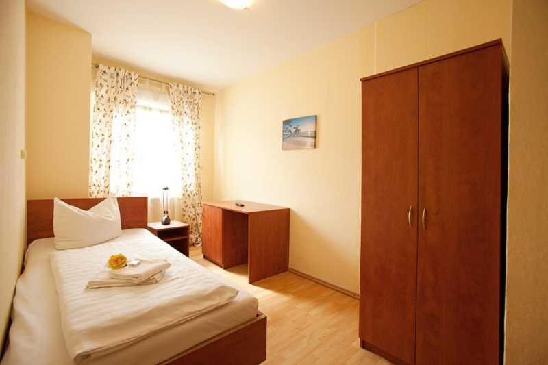Postel nebo postele na pokoji v ubytování Hotel Jasmin