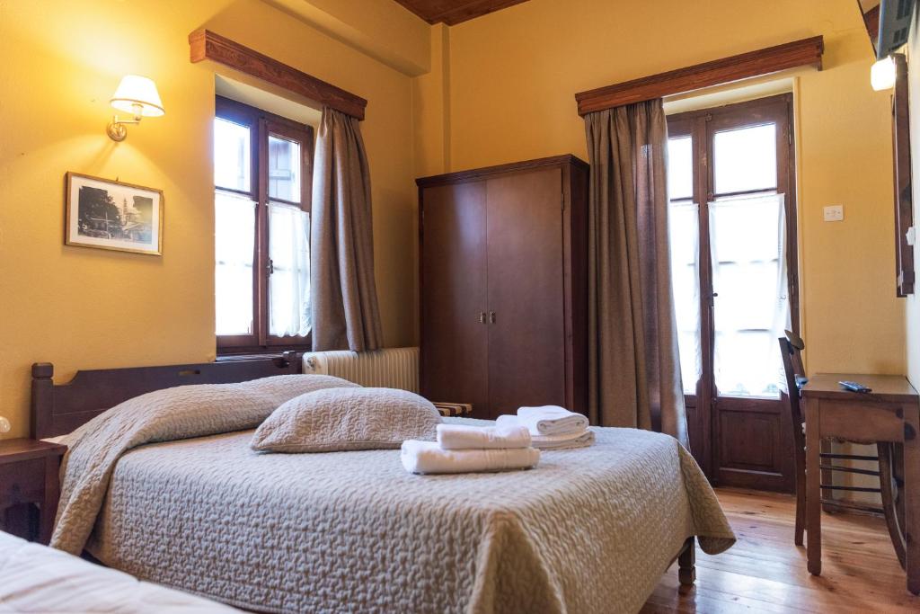 Voodi või voodid majutusasutuse Kentavros Hotel toas