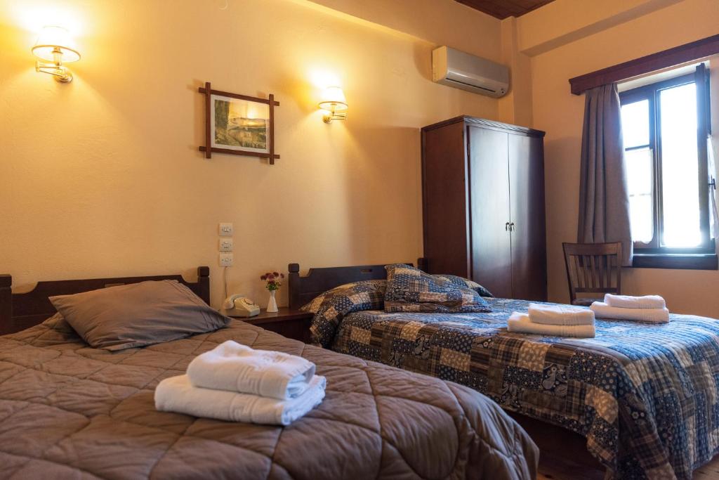 Voodi või voodid majutusasutuse Kentavros Hotel toas
