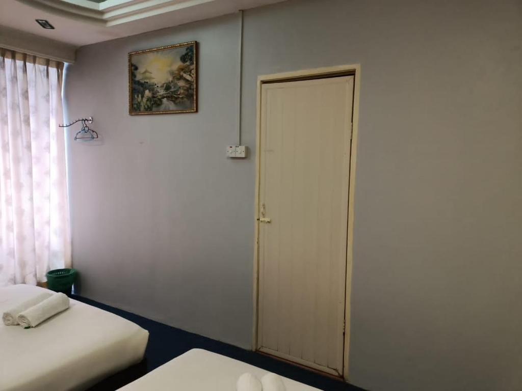 Postel nebo postele na pokoji v ubytování Hotel Tropicanna Pulai Point