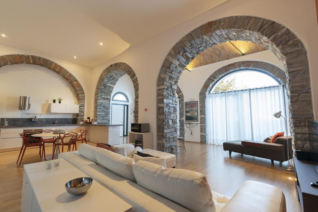 a living room with a couch and a table at I Platani in Lezzeno