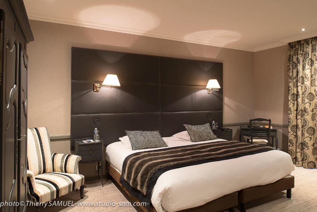 Postel nebo postele na pokoji v ubytování Le Grand Hotel & Spa