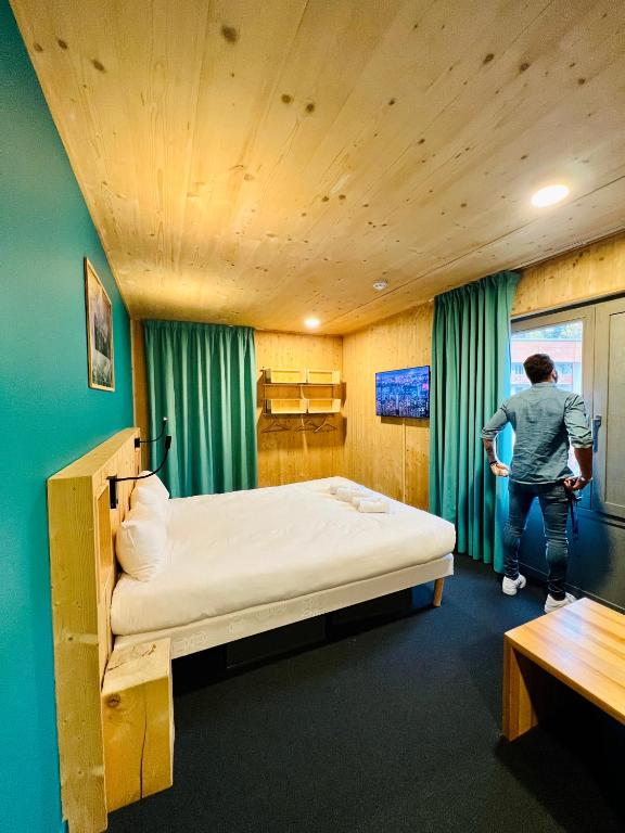 Postel nebo postele na pokoji v ubytování The People - Les 2 Alpes