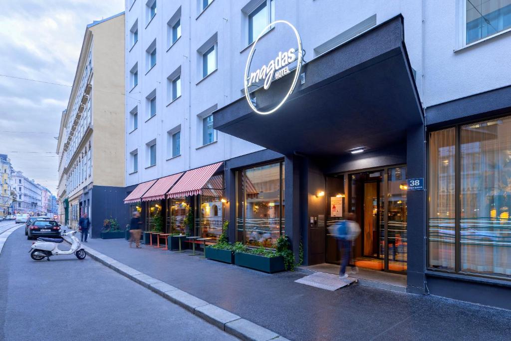 a store front of a building with a stroller outside at magdas HOTEL Vienna City - First Social Business HOTEL in Austria in Vienna