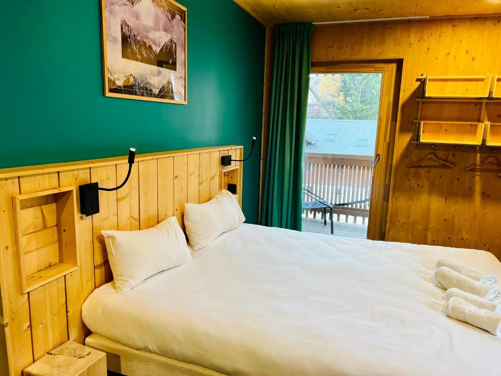 Postel nebo postele na pokoji v ubytování The People - Les 2 Alpes