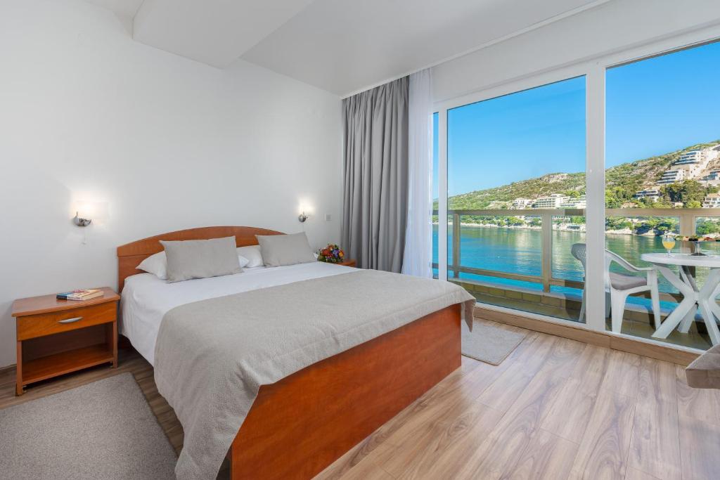 Postel nebo postele na pokoji v ubytování Hotel Vis