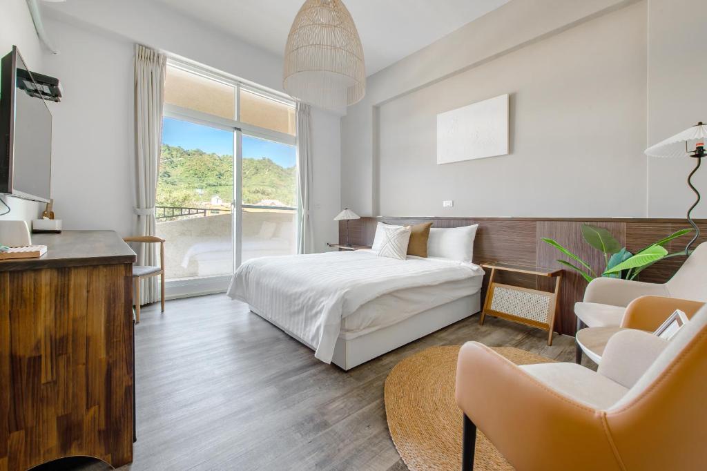 Postel nebo postele na pokoji v ubytování Yu Krung Style Inn