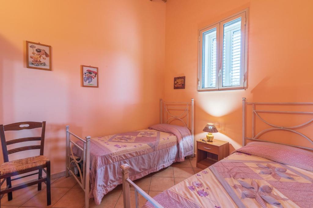 Posteľ alebo postele v izbe v ubytovaní Villa Gabri