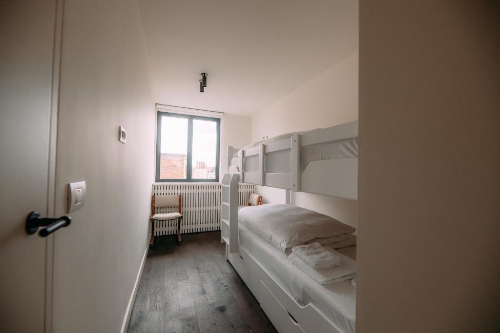 Posteľ alebo postele v izbe v ubytovaní Sud d'Anvers