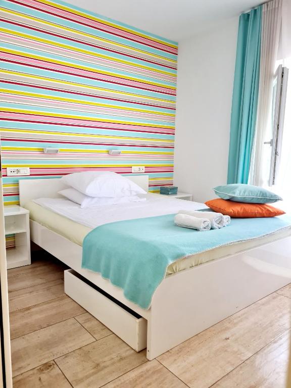 Postel nebo postele na pokoji v ubytování AZUR ROOMS LJUBLJANA