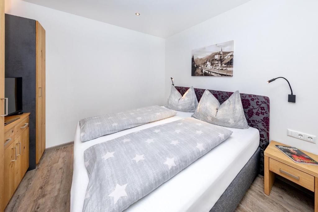 Ένα ή περισσότερα κρεβάτια σε δωμάτιο στο Elto Appartements Chalet